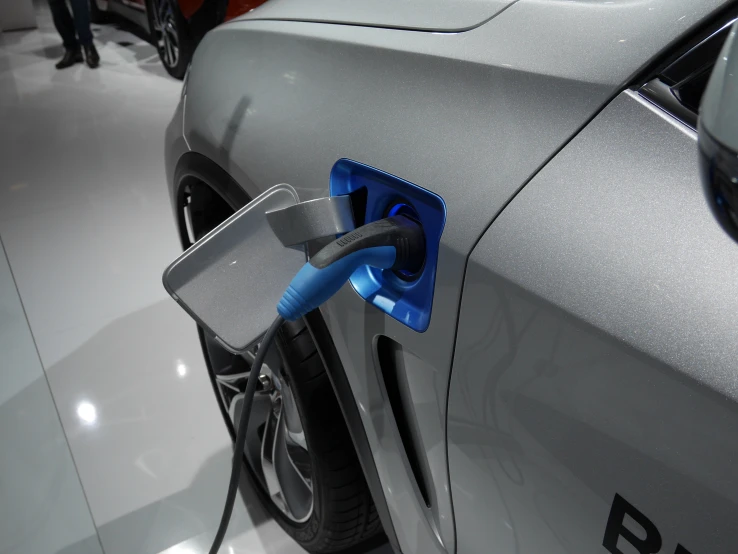 an electric car has an extension plug in the middle