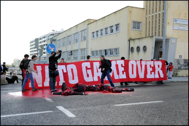 protesters are being held up near an aids sign