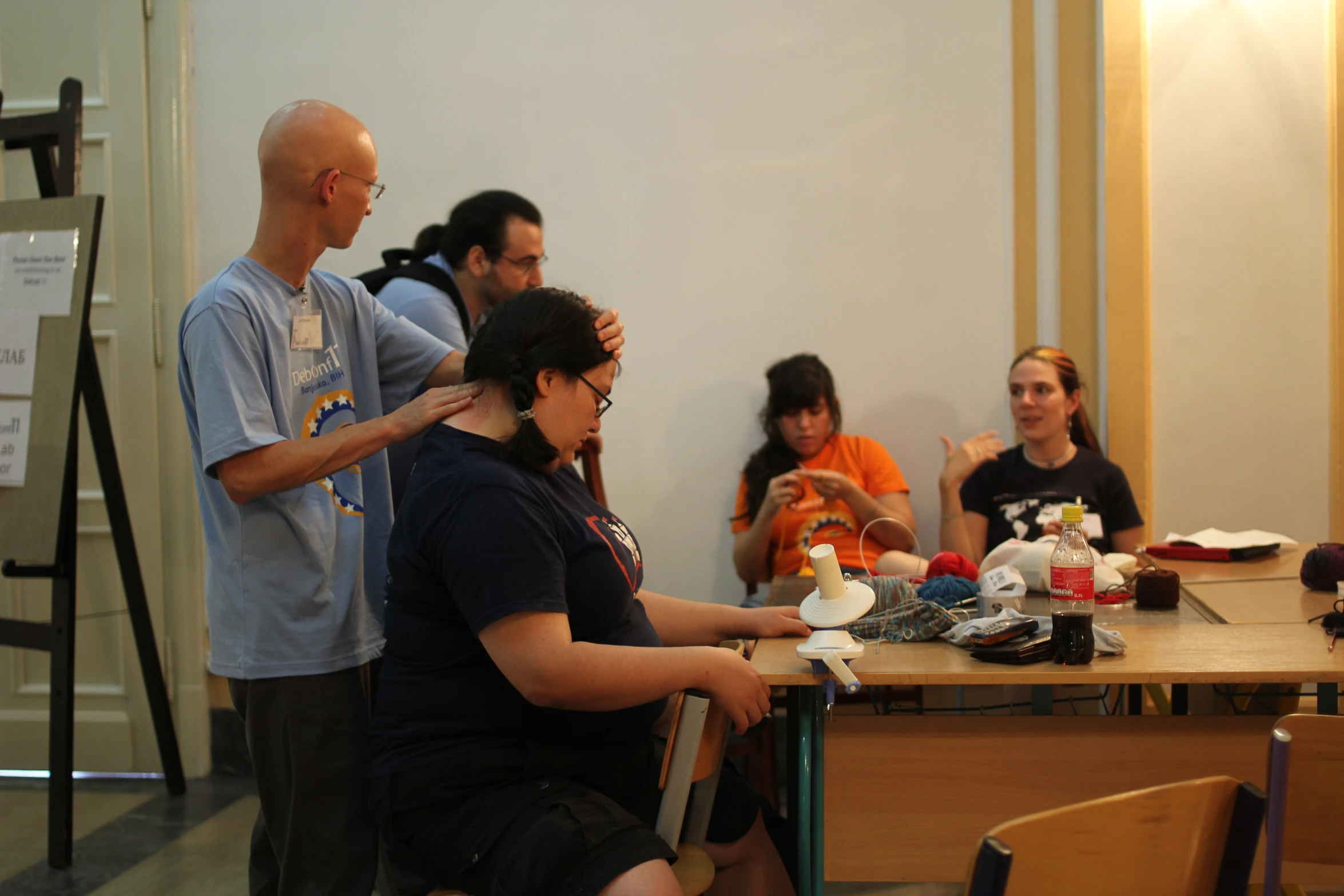 a woman on her computer in a crowded room