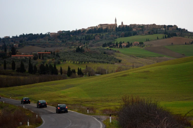 the cars are traveling down the winding road