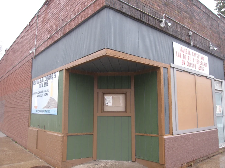 a door in the center of an empty brick building