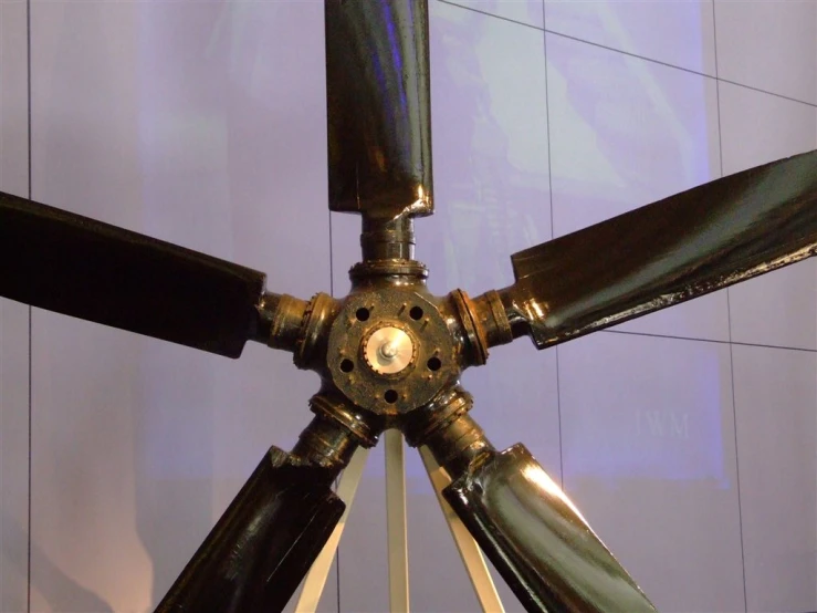 a close up of a small tripod with large propellers