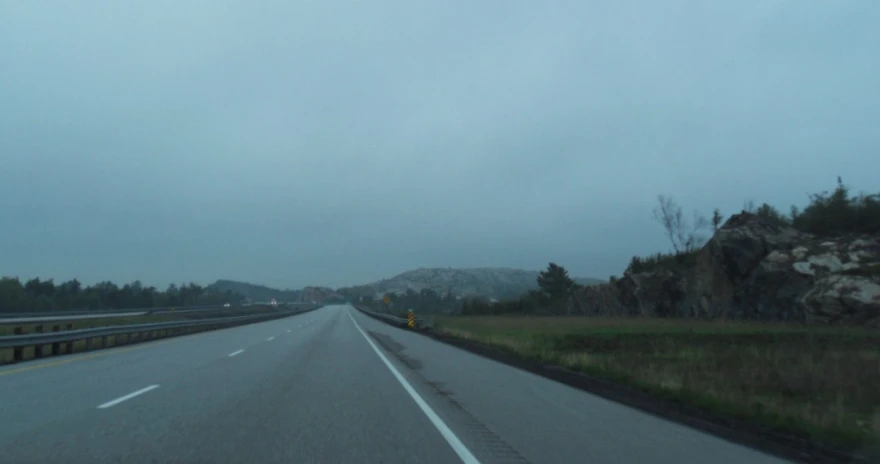 the street is empty of people and cars on a rainy day