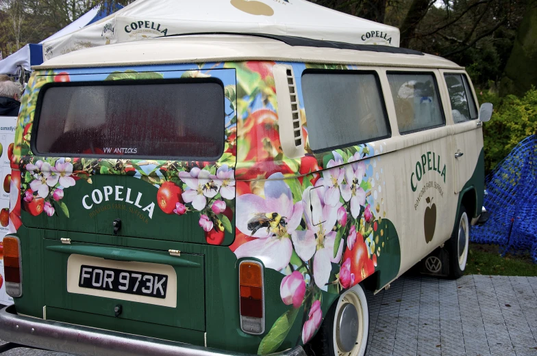 an old van has many flowers on it