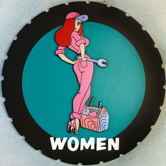 a circular sign with a woman wearing pink