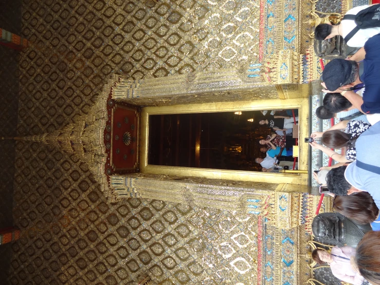 people gathered in a temple to see the performers