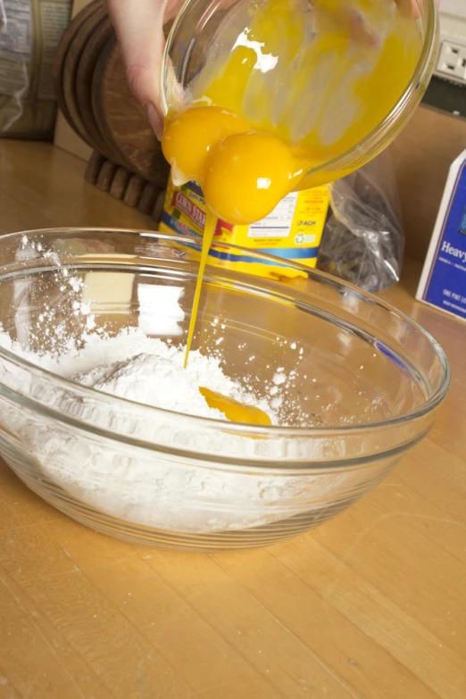 a close up of a bowl on a table with ingredients