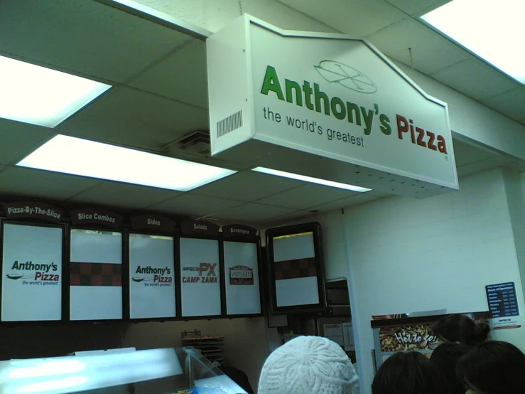 a po of a large sign above the counter in an office