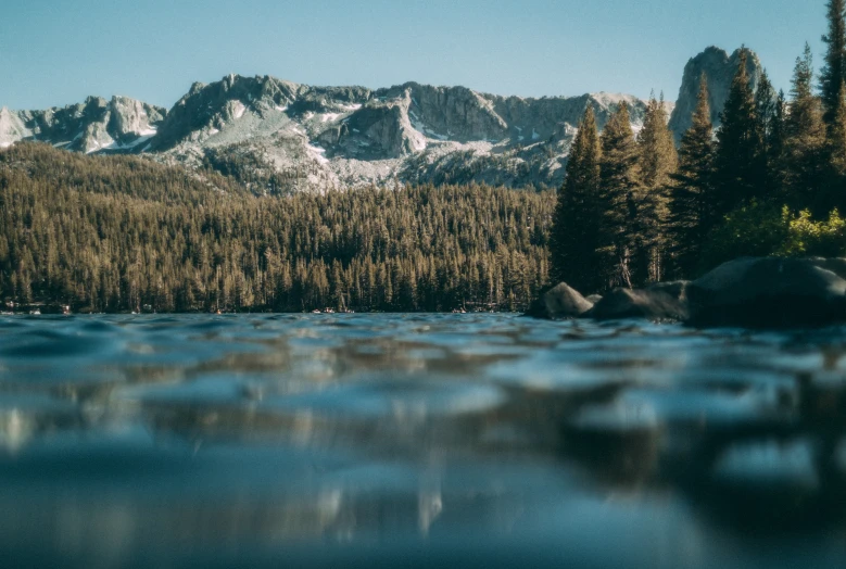 a lake in the mountains near a forest