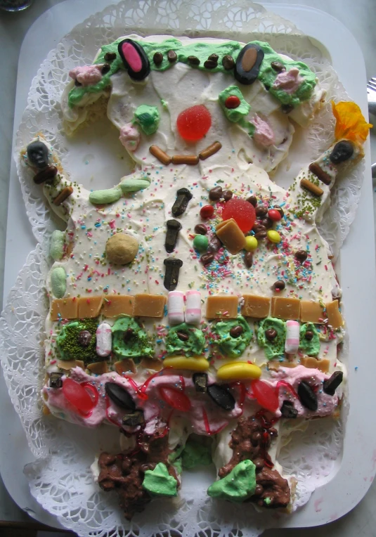 an image of a cake on paper with frosting and decorations