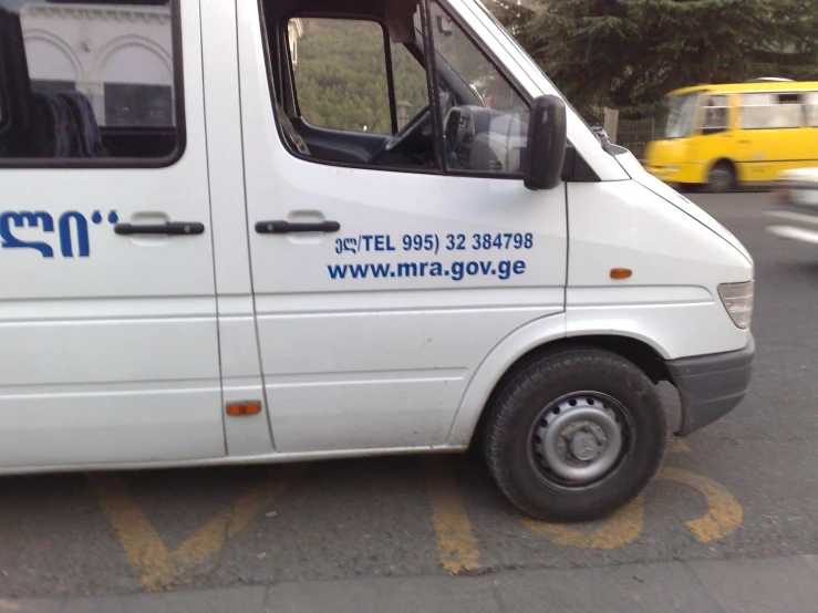 a white van is parked in a parking space