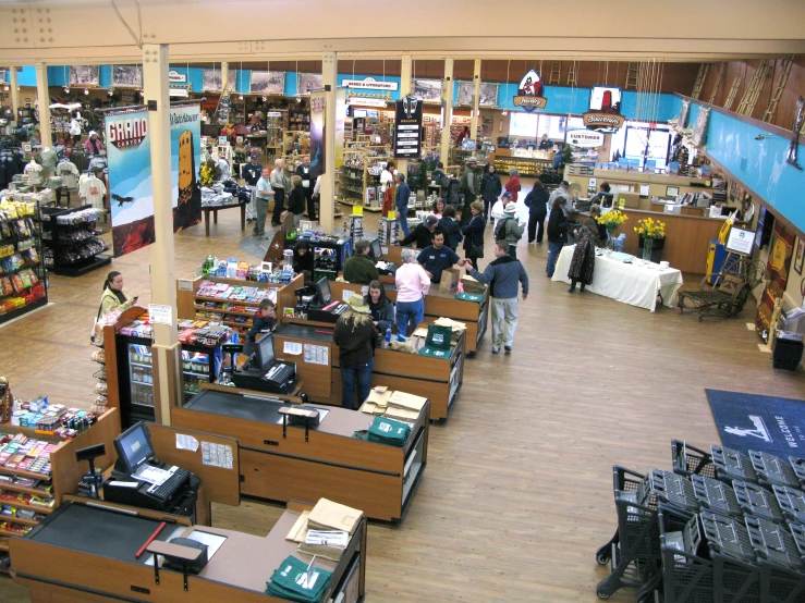 a store with lots of people and many books on tables