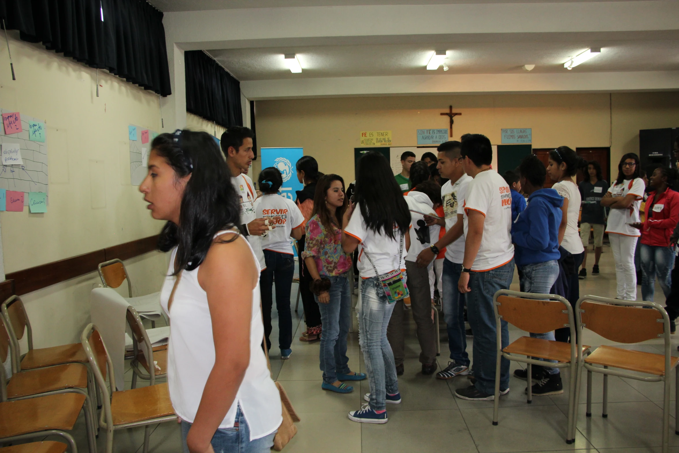 a group of people standing around in a room