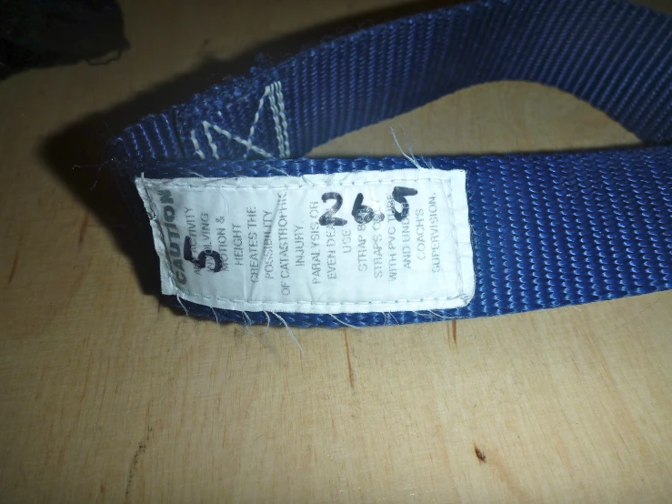a name tag is placed on a blue shirt