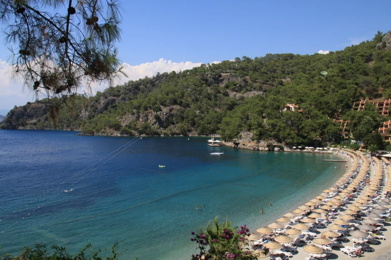 the beautiful water of lake with beach chairs and umbrellas