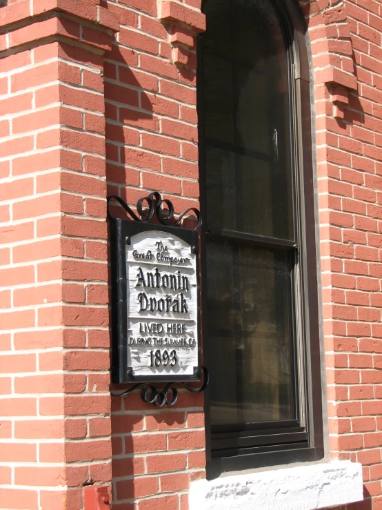 a sign for a restaurant outside a window