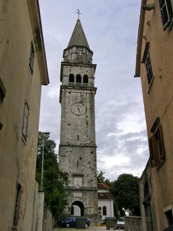 a clock tower is shown between two buildings