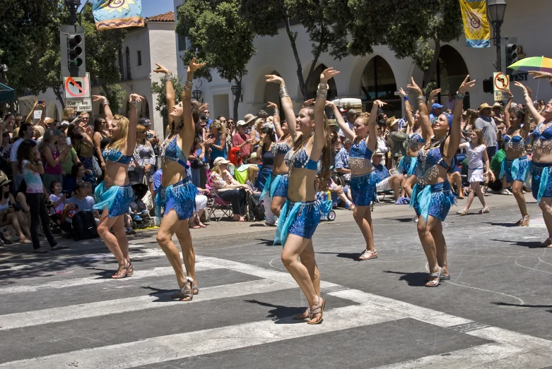 the girls are dancing together at the street party