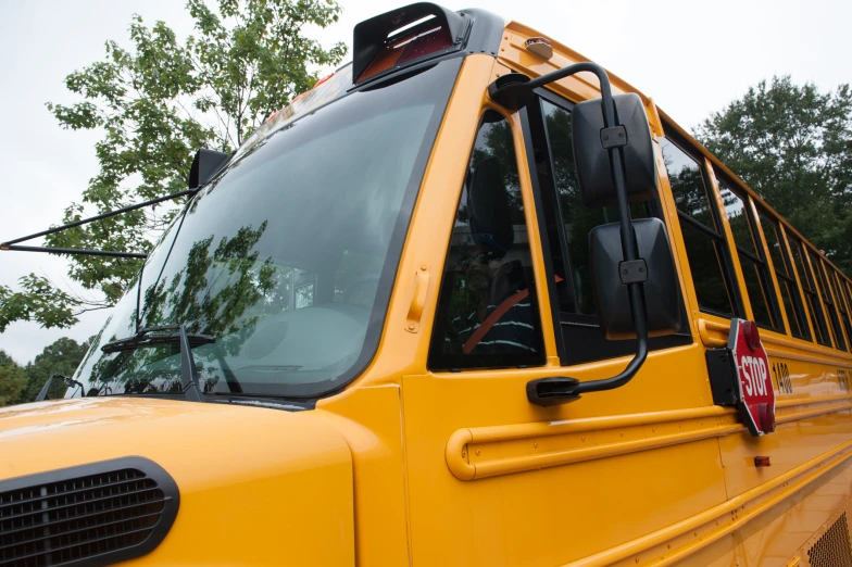 a large school bus has the door open