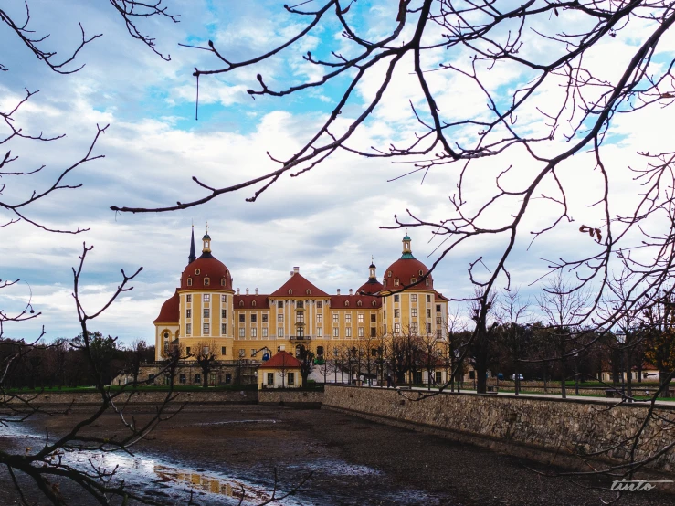 there is a very large building with towers in the park