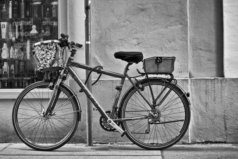 the bike is parked next to the building