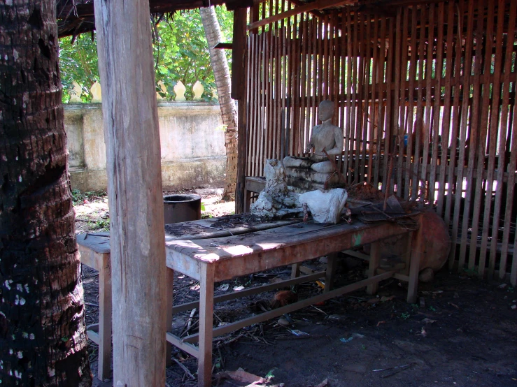 an outhouse has various old objects in it