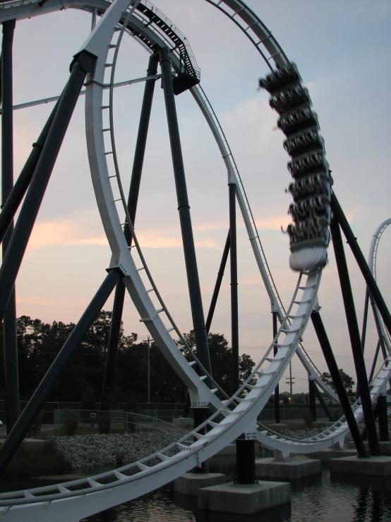 the amut coaster at a theme park on a cloudy day