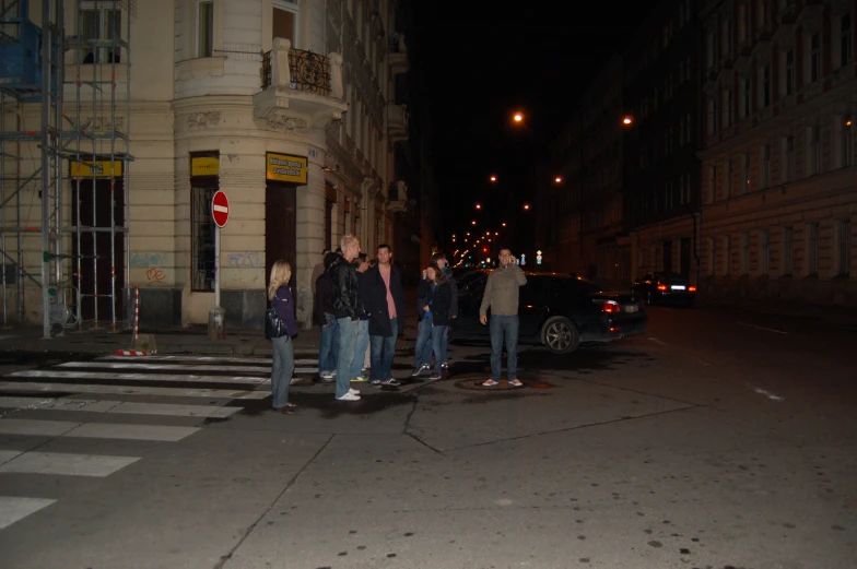 five young people on the side of the street