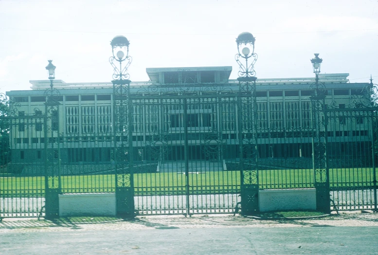 an old building has many iron fences around it