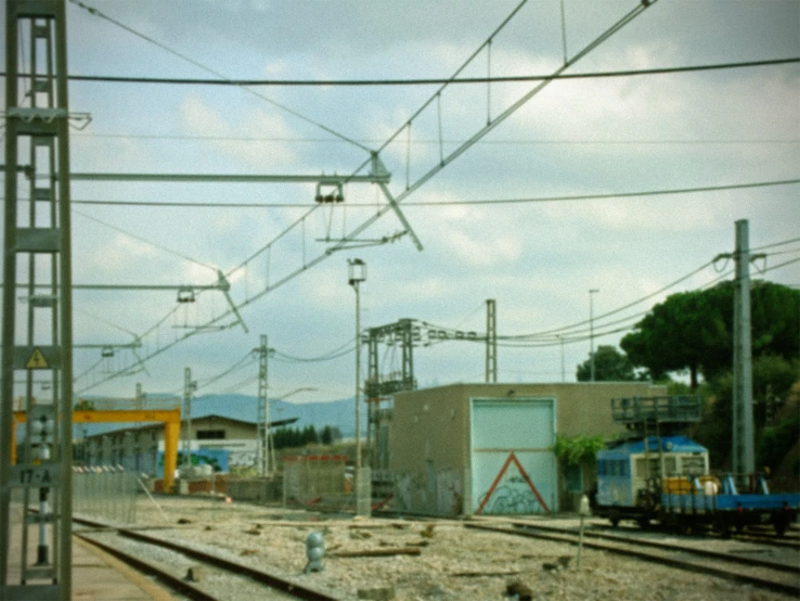 an overhead view of train tracks and buildings