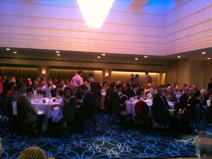 a room full of people with tables covered in tables