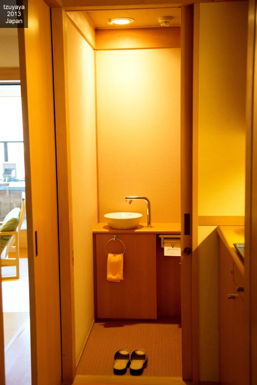 a bathroom area with a sink and mirror