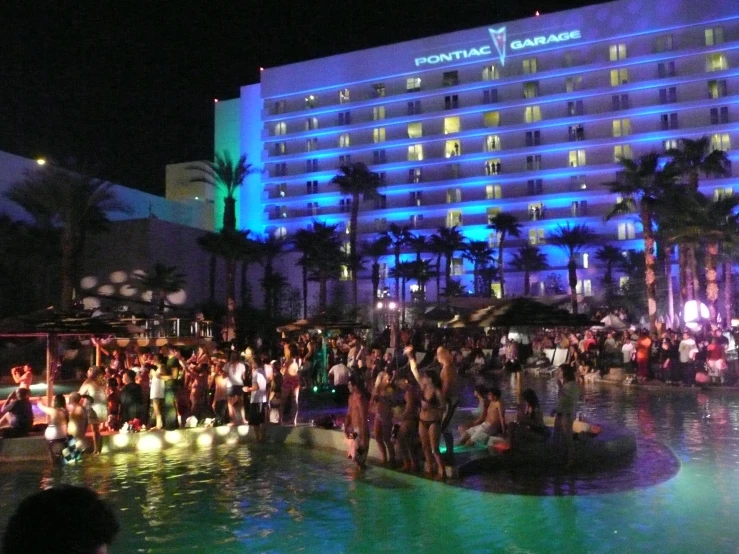 the pool at night is illuminated with lights