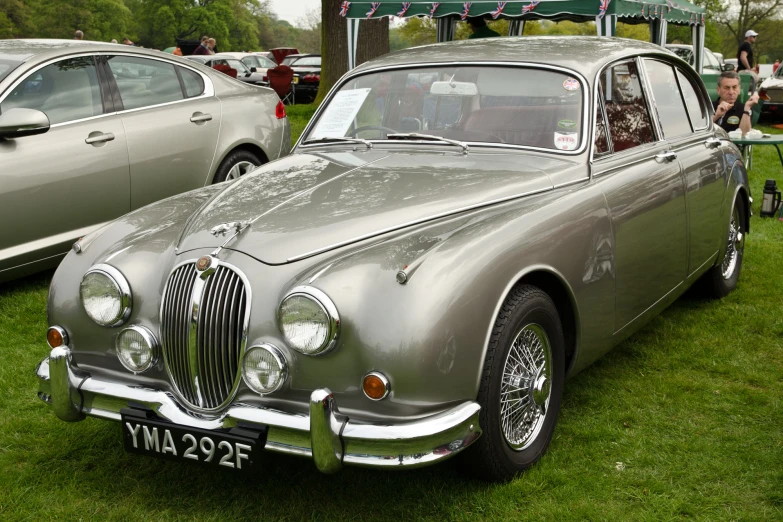 an antique car parked at a car show