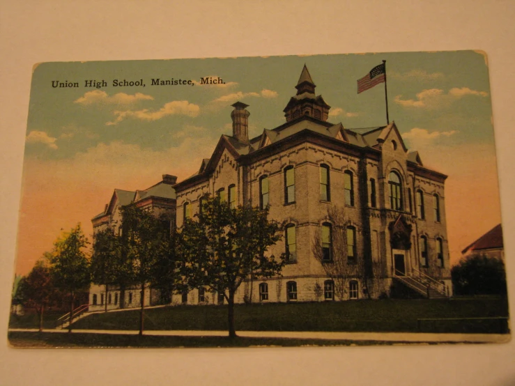 an old postcard with a clock tower is shown