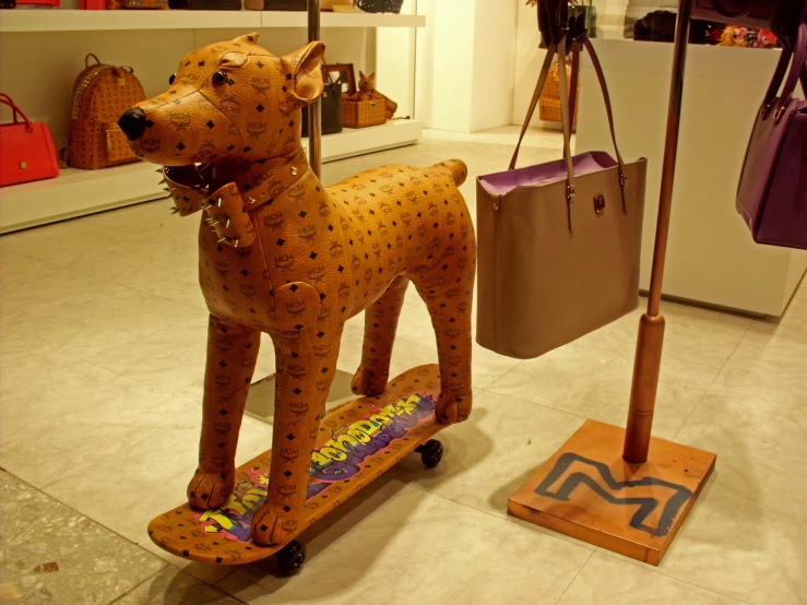 the sculpture of a dog is decorated in gold foil and decorated with jewels