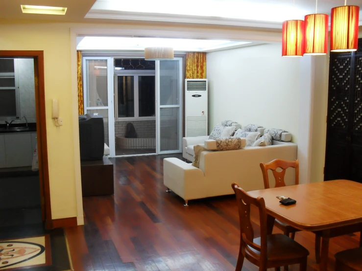 a view of the kitchen, living room, and dining room from across the living room