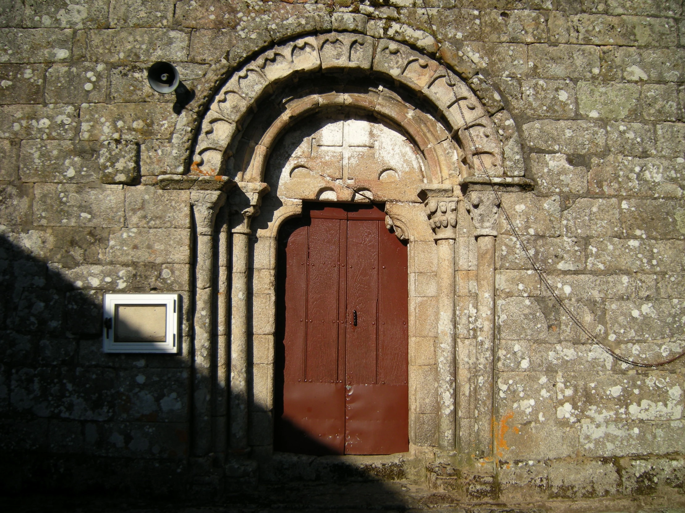 a doorway and window is on a building