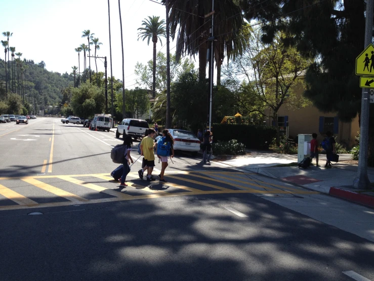 s crossing the street in a cross walk