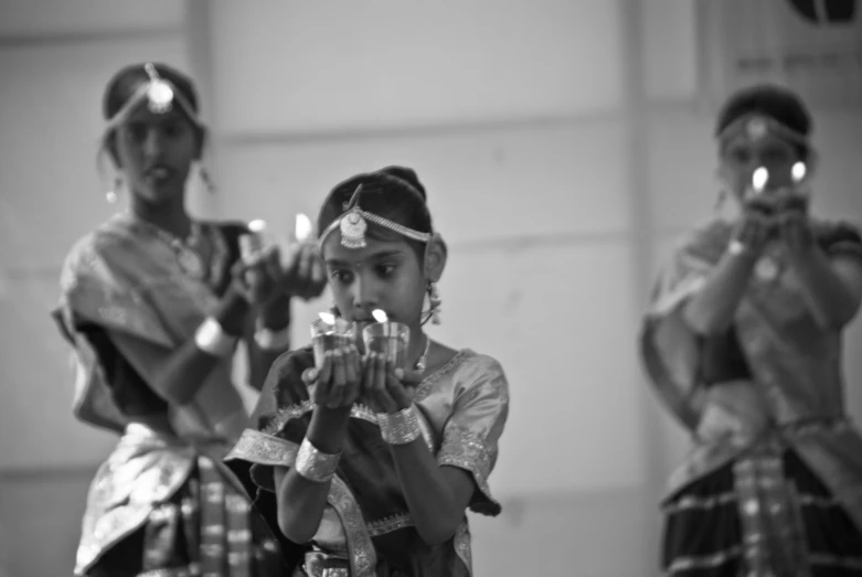children performing traditional dance for an audience