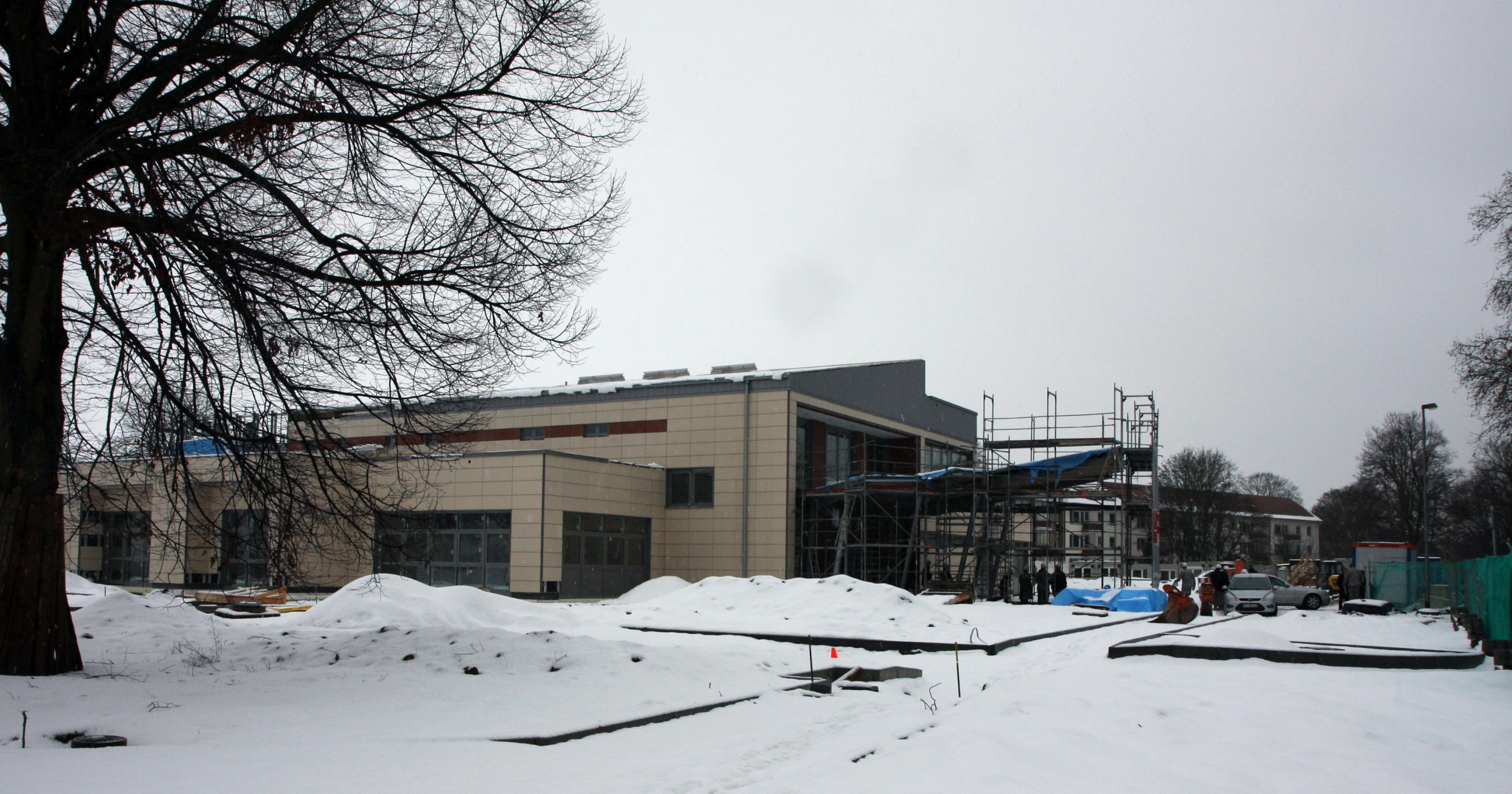 a view of the exterior of an office building in the snow