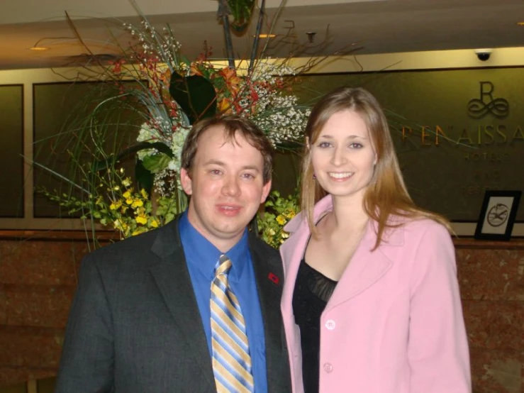 a young couple are posing for a picture at a restaurant