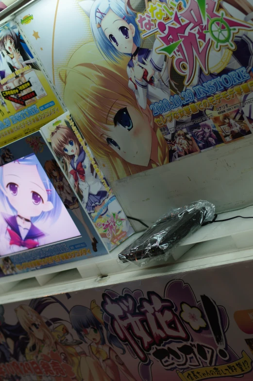 an image of a wall with various anime poster
