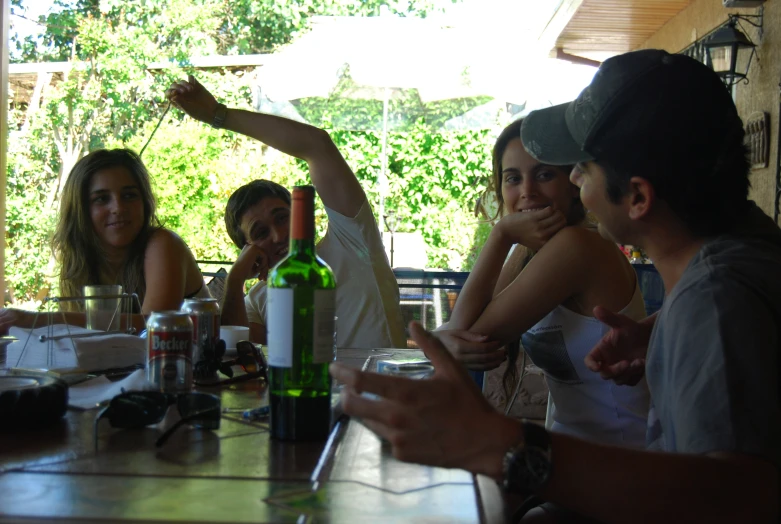 a group of people at a table at a restaurant