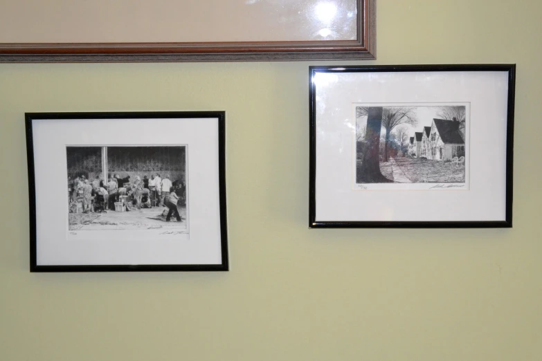 two framed pos of people walking in the snow, and one showing a large building