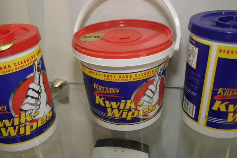 two cans of klipe whip with one canister in front