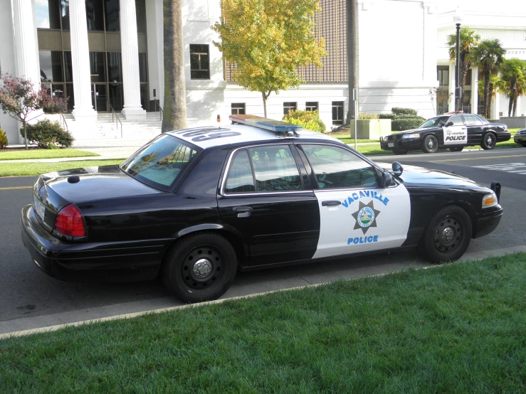 there is a police car that is parked on the street