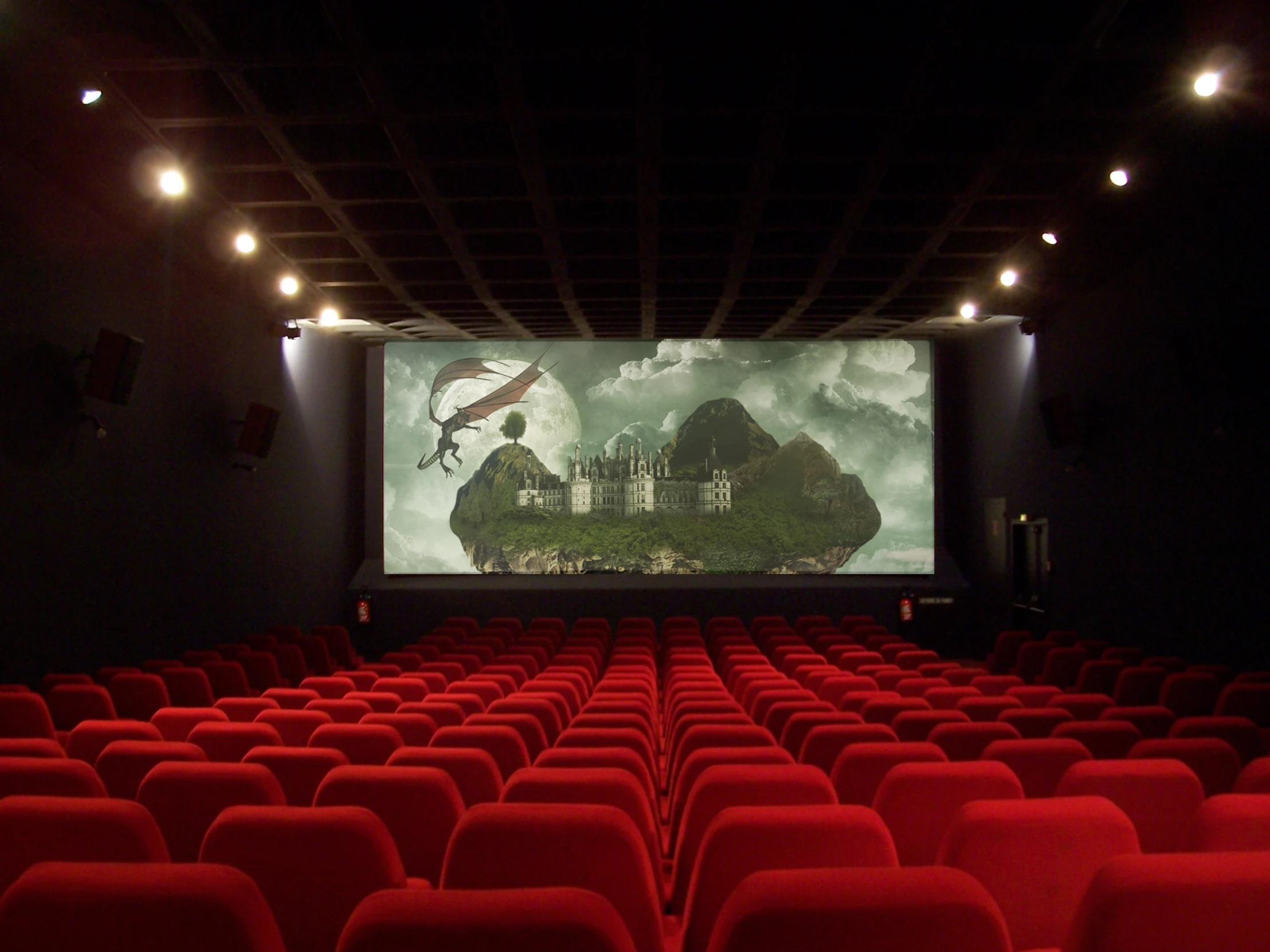 a screen in a theater with red chairs