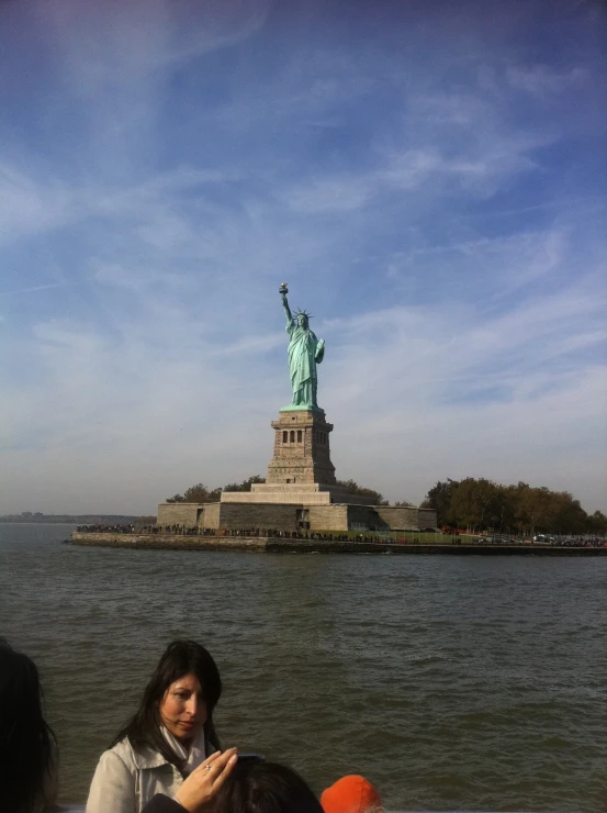 some people are standing in a boat in the water