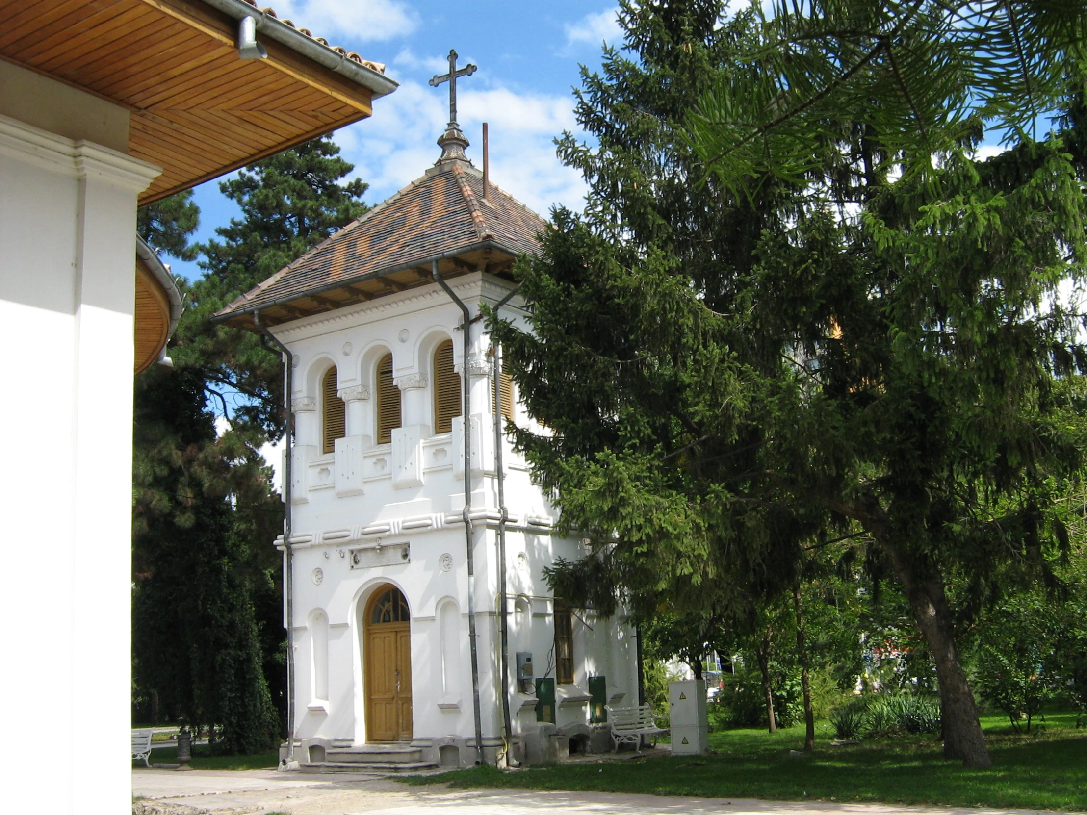 there is a large white building with a cross on it